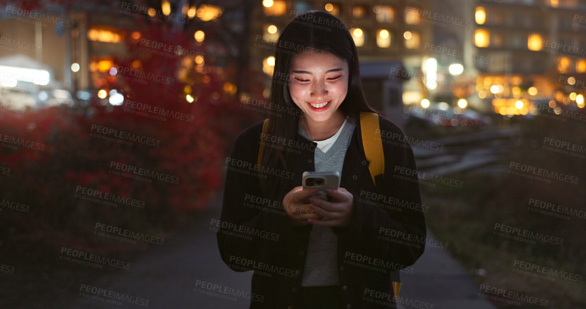 Buy stock photo Asian woman, phone and night for communication, social media or outdoor networking in city. Female person walking with mobile smartphone in late evening for online chatting in urban town of Japan