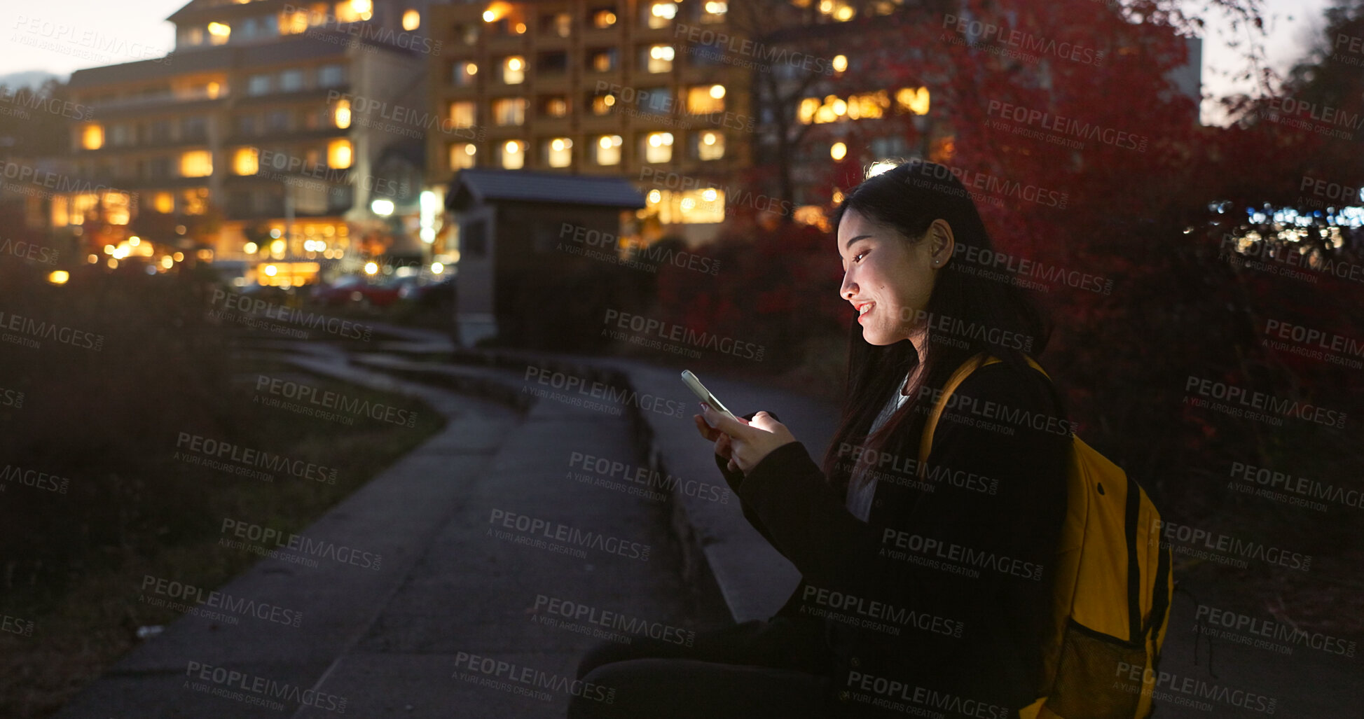 Buy stock photo Asian woman, phone and night at city for social media, communication or outdoor networking. Female person relax on mobile smartphone in the late evening for online chatting in urban town of Japan