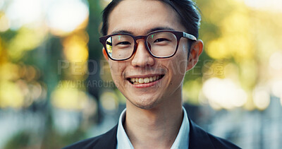 Man, Asian in city and face with travel or commute to work, glasses and professional in Tokyo. Corporate lawyer in urban street, journey to office and happiness in portrait with business vision