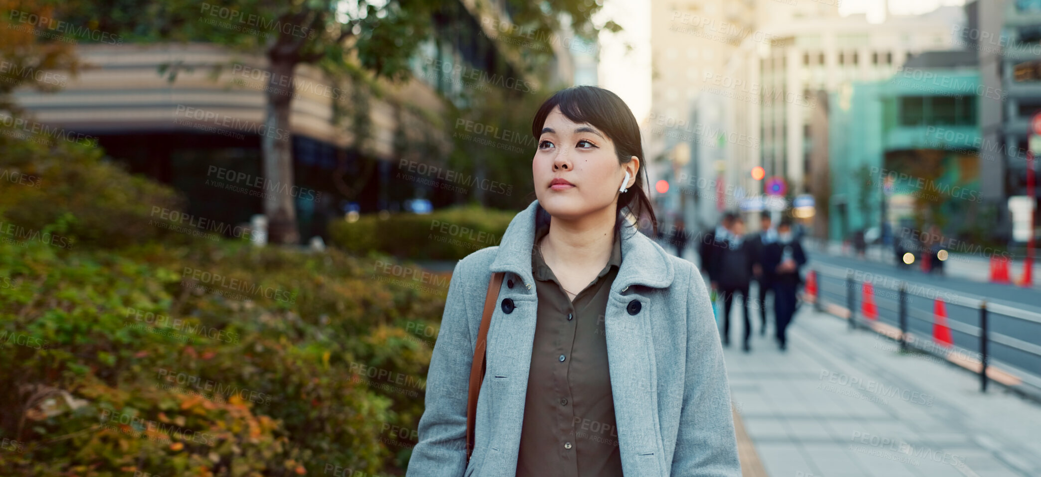 Buy stock photo Woman, Asian and walking, travel or commute to work with professional in city with earphones. Listening to music on journey, podcast and commuter on urban street or sidewalk in Tokyo with playlist
