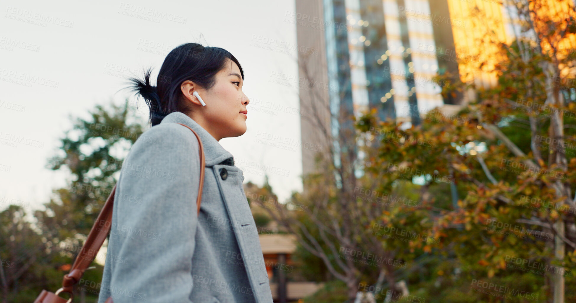 Buy stock photo Woman, Asian and earphones, travel in city and commute to work with radio or podcast outdoor. Technology, spin and listening to music on journey, urban street and professional walking outdoor