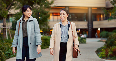 Buy stock photo Walking, conversation and business women in the city talking for communication or bonding. Smile, discussion and professional Asian female people speaking and laughing together commuting in town.