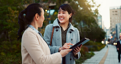 Buy stock photo Asian woman, tablet and team on sidewalk in city for communication, research or social media. Business people smile with technology for online search, chat or networking on pavement in an urban town