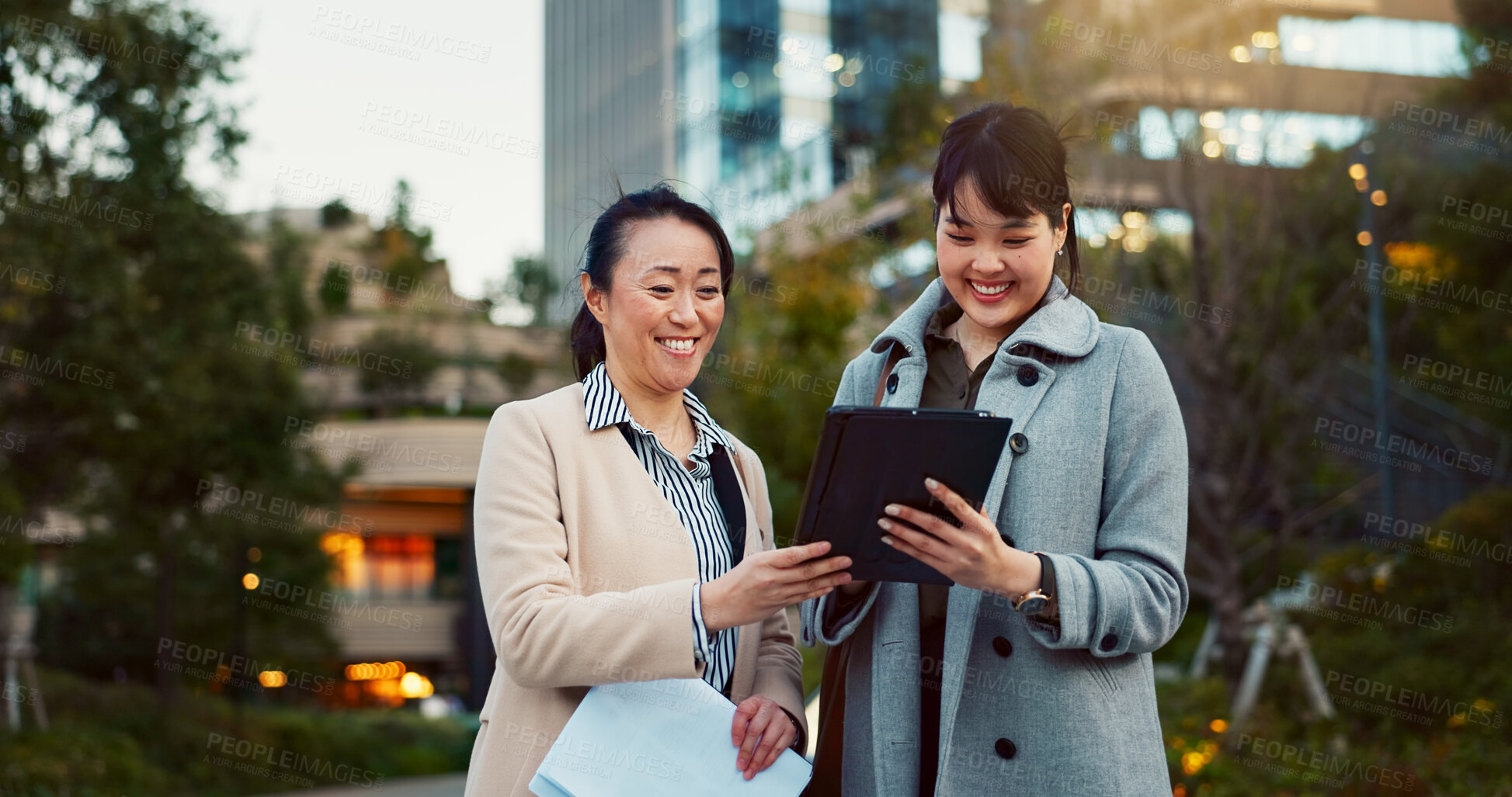 Buy stock photo Tablet, conversation and business women in the city talking for communication or bonding. Smile, discussion and professional Asian female people speaking with digital technology together in town.