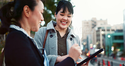 Asian woman, tablet and team in city of Japan for communication, research or social media together. Business people smile on technology for online search, chat or networking on sidewalk in urban town