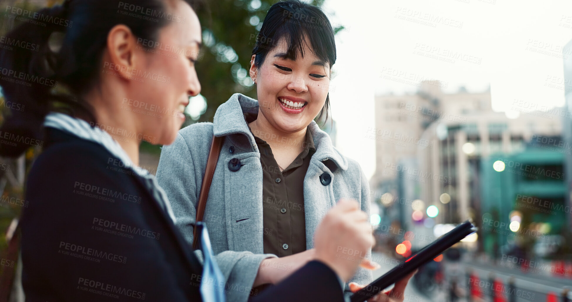 Buy stock photo Asian woman, tablet and team in city of Japan for communication, research or social media together. Business people smile on technology for online search, chat or networking on sidewalk in urban town