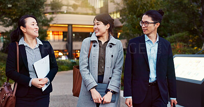 Walking, conversation and business people in the city talking for communication or bonding. Smile, discussion and professional Asian colleagues speaking and laughing together commuting in town.