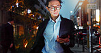 Tablet, night and Asian businessman in the city reading a blog on a website or internet. Online, glasses and young professional male person networking on digital technology in urban town street.