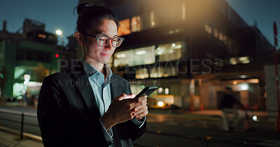 Buy stock photo Businessman, phone and typing at night in city for communication, social media or outdoor networking. Happy asian man or employee smile on mobile smartphone in late evening for chatting in urban town