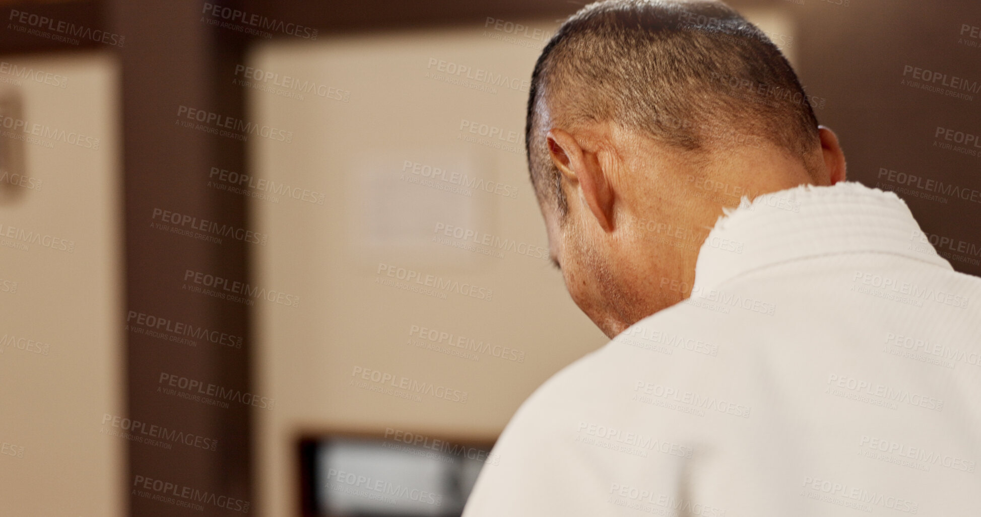 Buy stock photo Aikido, student and man bow in respect for martial arts, class or walking in traditional gym. Japanese, sensei and mature fighter with humble greeting, master or welcome to competition with kindness