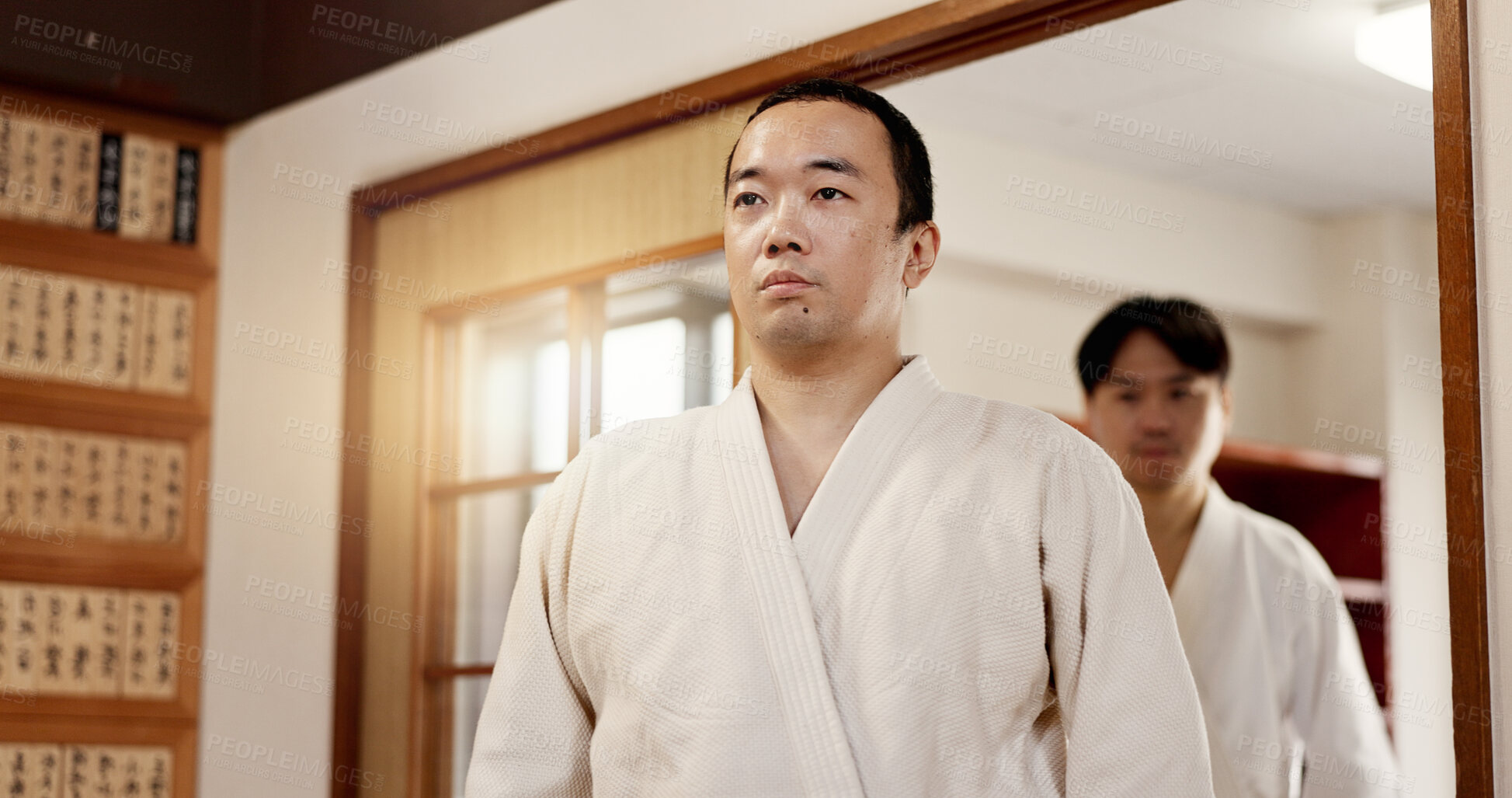 Buy stock photo Aikido student, ready or men in dojo to start practice, discipline or self defense education in Japan. Master, people learning sports or athletes walking in fighting class, lesson or training