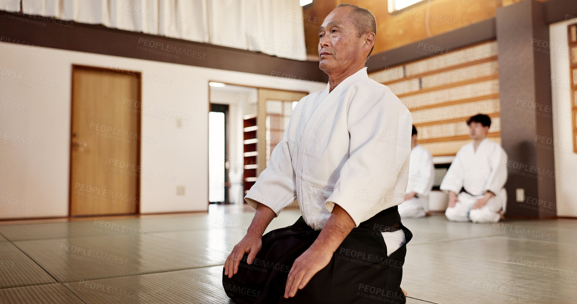 Buy stock photo Sensei, Japanese and students in dojo for aikido tradition or respect for exercise, black belt or self discipline. Male people, fighting education in Tokyo as professional battle, athlete or safety
