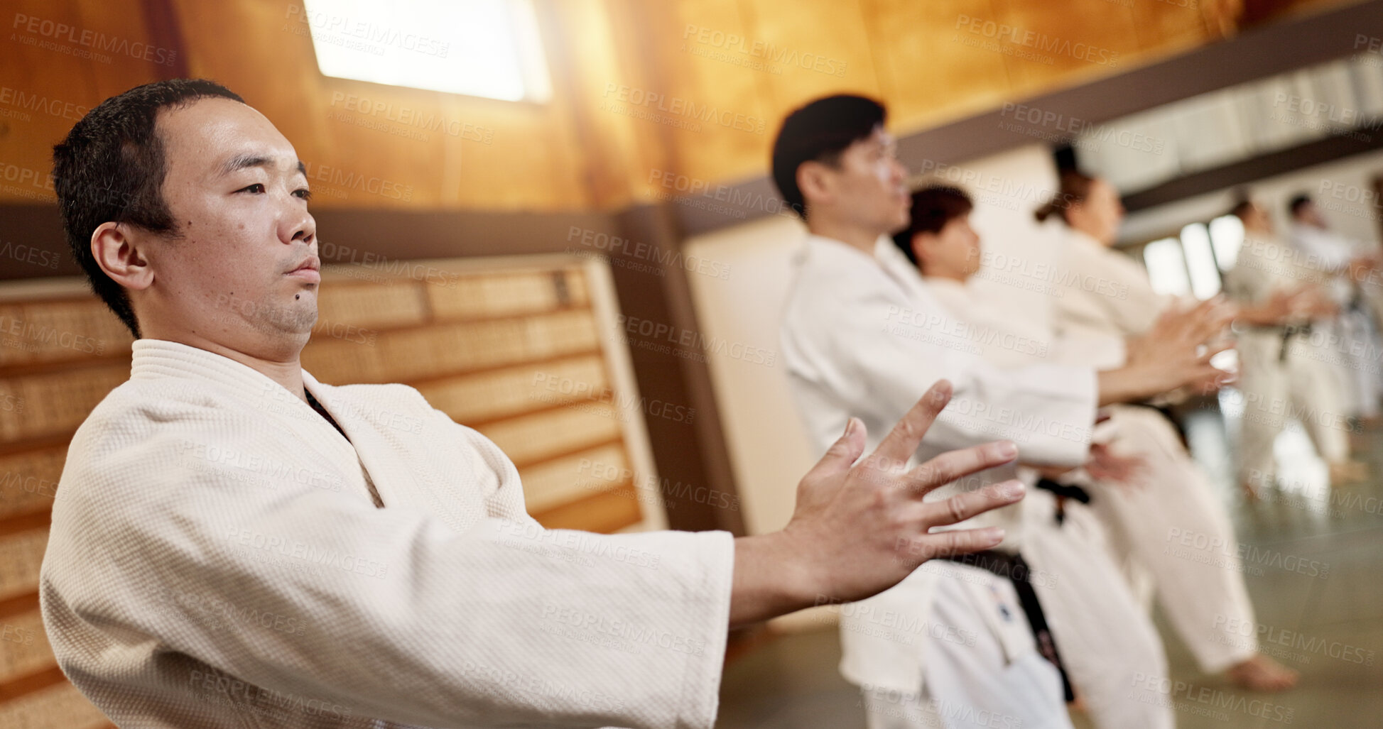 Buy stock photo Aikido class, group and fight for martial arts, strike or together for combat at training, gym or dojo. Japanese people, students or sensei for exercise, workout or fitness with zen, conflict or club