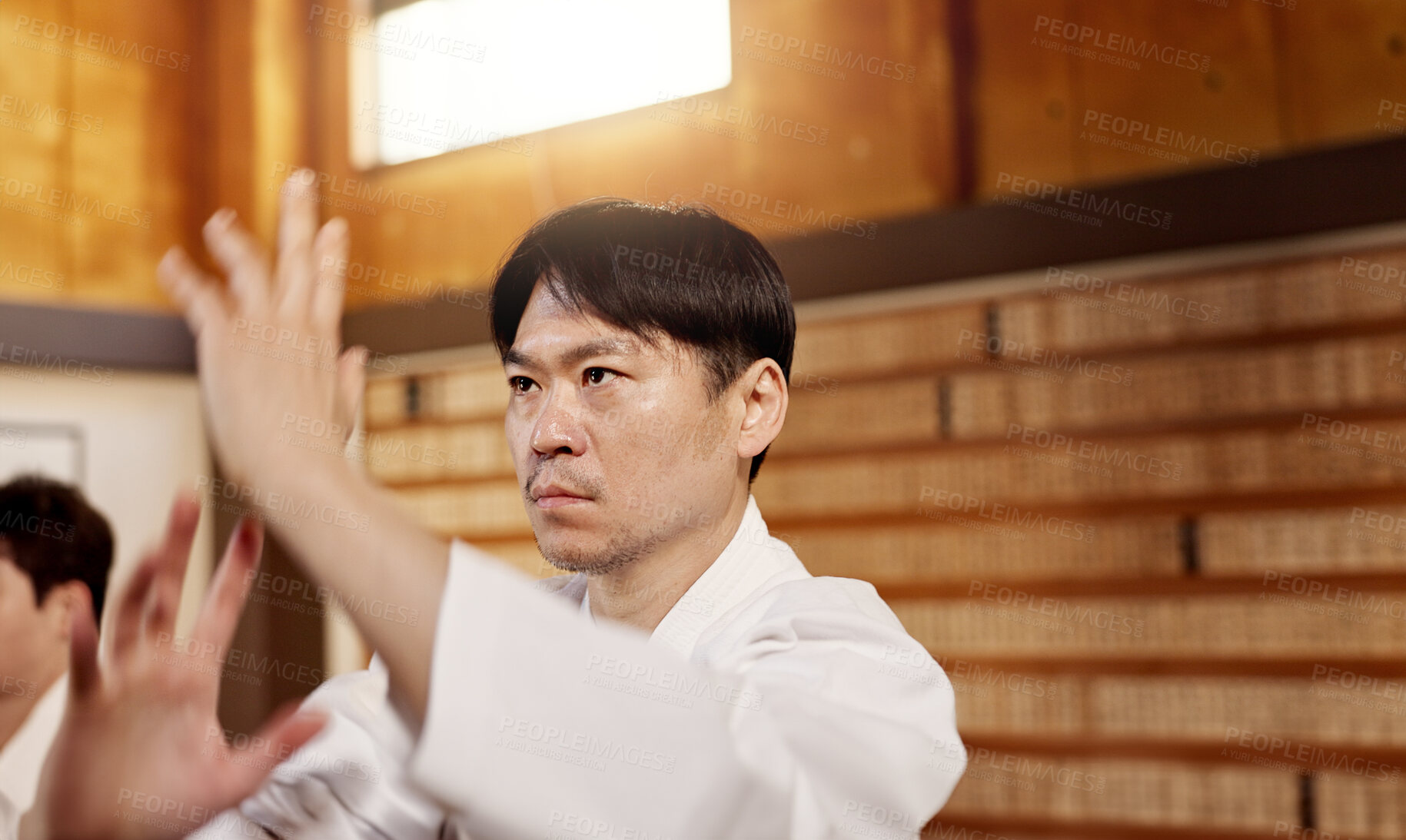 Buy stock photo Japanese student, aikido or training martial arts in dojo for practice, fighting education or self defense. Combat routine, wellness or male person with workout, body movement and class with peace