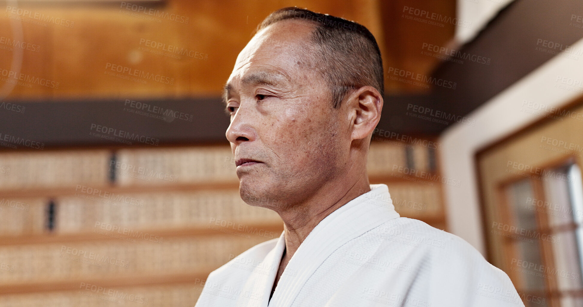 Buy stock photo Aikido, master and man in martial arts in class or sensei with pride in traditional gym for japanese fighting. Attention, mature fighter or education of self defence, skill or instruction in practice