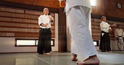 Buy stock photo Japanese students, aikido or sensei in dojo to start practice lesson, discipline or teaching self defense. Black belt master, people learning combat or athletes in fighting class, training or sports