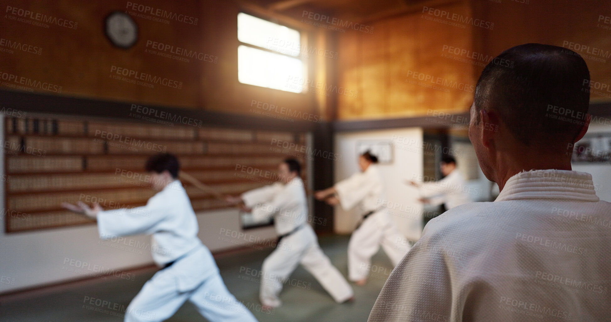 Buy stock photo Japanese students, lesson or sensei in dojo to start aikido practice, discipline or teaching self defense. Black belt master, people learning combat or athletes in fighting class, training or sports