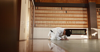 Buy stock photo Japanese student, bow or man in dojo to start aikido practice, discipline or self defense education. Black belt master greeting, athlete learning respect or ready in fighting class or training alone