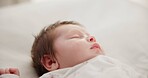 Baby, face and sleeping in the morning on nursery bed and blanket with nap and rest. Relax, calm and tired newborn with youth on bedding with kid sleeping from above in a family home and bedroom