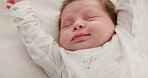 Baby, sleeping stretch and nursery bed with morning, nap and dreaming of a young newborn at home. Cozy, sleepy kid and calm with health development from rest and peace in house with closeup and care