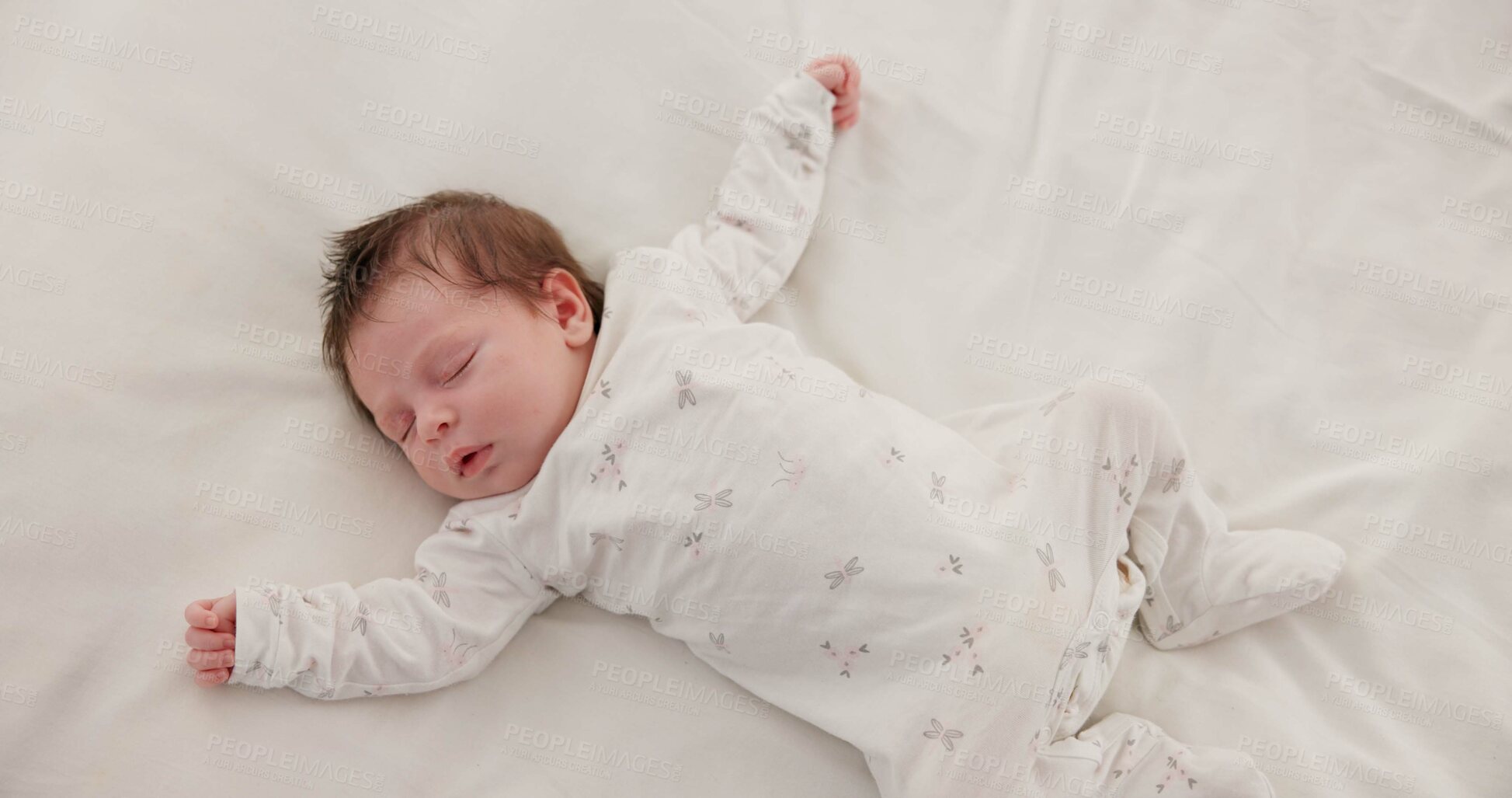 Buy stock photo Sweet, sleeping and newborn baby on a bed at a home in the bedroom for resting and dreaming. Cute, tired and top view of infant, child or kid taking a nap in the morning in nursery at family house.