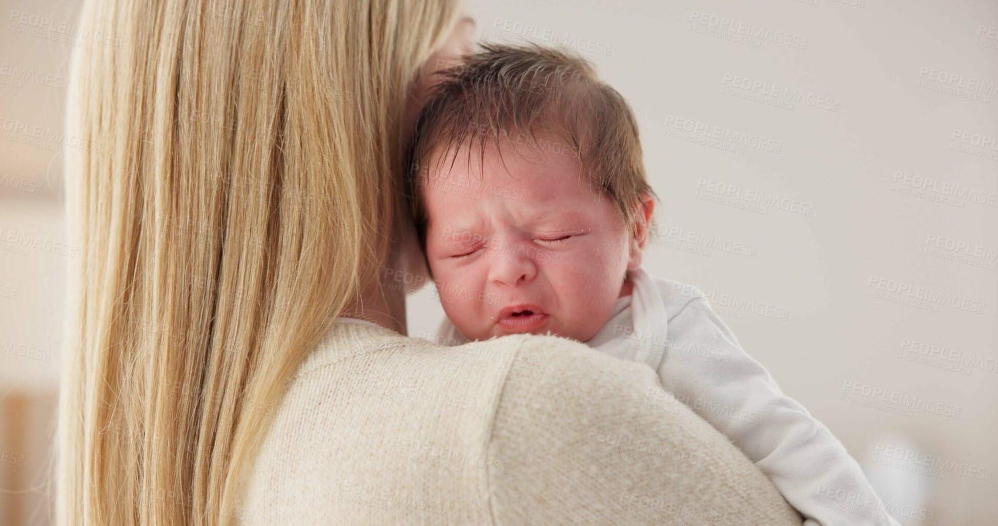 Buy stock photo Comfort, mother and a crying newborn for love, care and sad in the morning. House, family and a young mom or woman with affection, support and holding a baby, child or kid for sleep, rest or tired