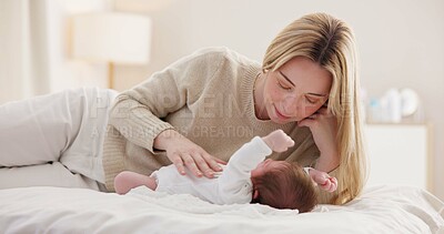 Children, love and a mother on the bed with her baby for sleep, rest or bonding together in a home. Family, bedroom and a woman in an apartment with her newborn infant to relax for care or growth