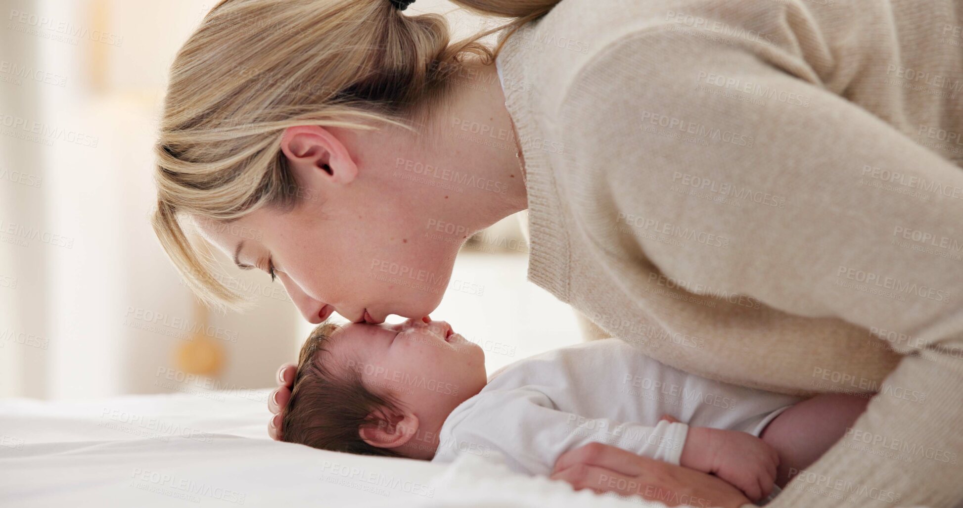 Buy stock photo Happy, mother and baby kiss with love, care and support in a home with newborn and bonding. Morning, mom and relax infant with child security and motherhood in a family home on a bed with mama