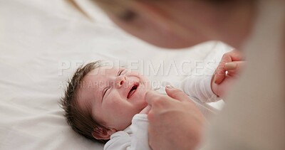 Baby, mother and playing on bed in nursery for bonding, love and support for child development. People, woman and newborn in bedroom of home with fun, hands or happiness for bond, care and smile