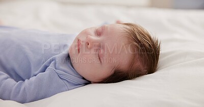 Buy stock photo Relax, growth and sleep with a baby on a bed closeup in a home, dreaming during a nap for child development. Kids, calm and rest with an adorable newborn infant asleep in a bedroom for comfort