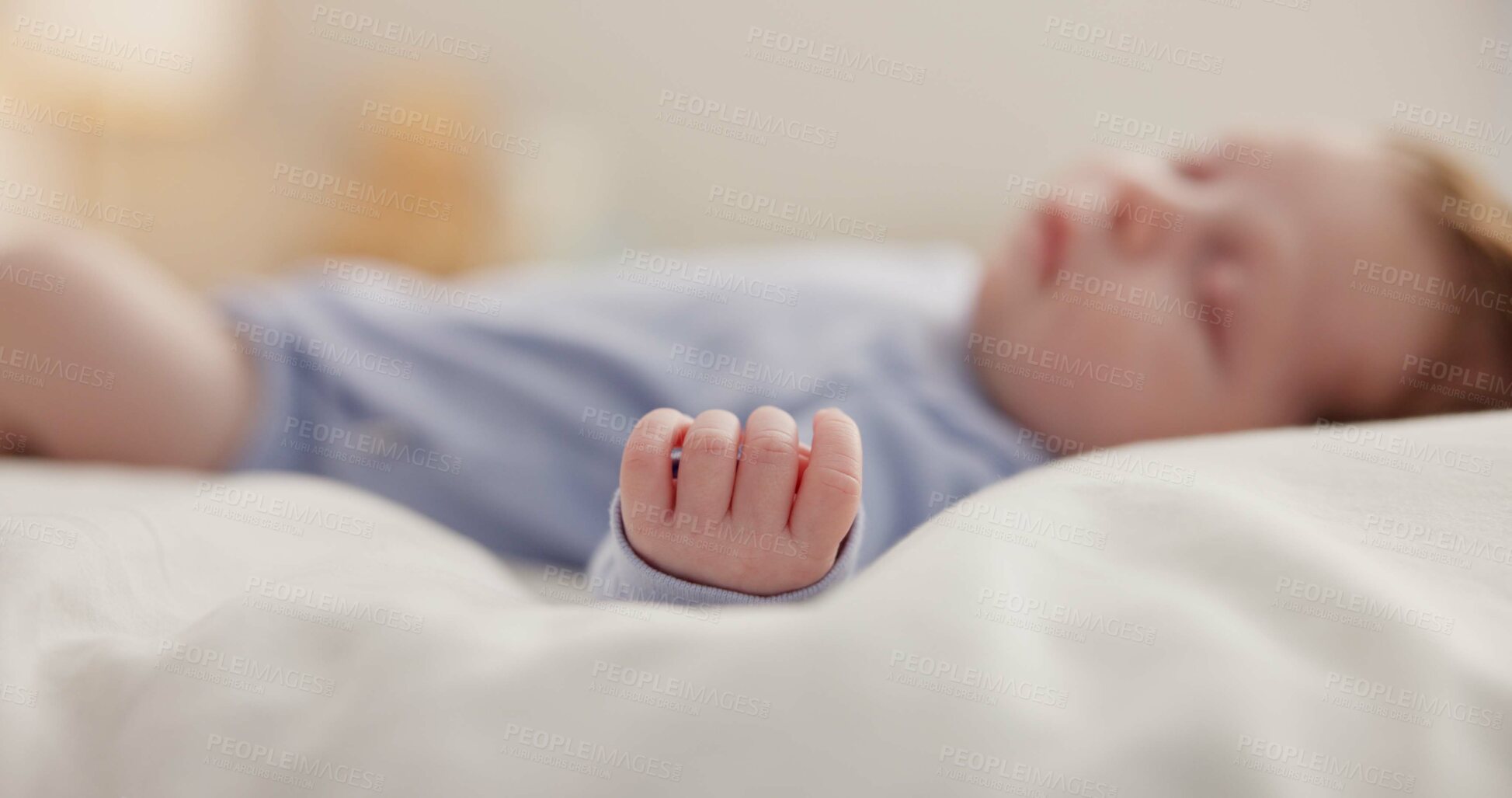 Buy stock photo Hand, baby and sleeping on bed in nursery with relaxing, resting and nap on blanket in morning. Newborn, peaceful and dreaming in bedroom of home for child development, growth and nurture or relax