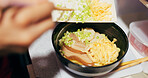 Japanese, ramen and food in restaurant with spring onion and ingredients, chopsticks and chef skill with decoration. Person cooking traditional cuisine, closeup with nutrition and garnish on noodles