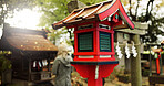 Japan, nature and wooden lantern in Kyoto with trees, tourist and woman with torii gate. Architecture, japanese culture and shinto shrine in woods with sculpture, religion memorial and monument