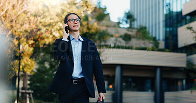 Buy stock photo Phone call, walking and business man on city journey, morning travel and speaking on mobile discussion. Smartphone conversation, communication and Japanese agent talking with contact on urban commute