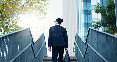 Buy stock photo Stairs, walking and back of businessman in the city by office building for travel with career. Outdoor, energy and professional male person commuting on steps to modern workplace in urban town.