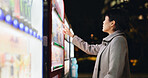 Vending machine, woman and phone payment at night, automatic digital purchase or choice of food in city outdoor. Smartphone, shopping and Japanese business person on mobile technology in urban town