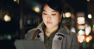 Buy stock photo Business woman, city and tablet at night to scroll website, reading information and update app online. Japanese worker with digital software, social network or search internet in dark street of Tokyo