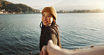 Happy, face and a couple holding hands at the beach for love, date or travel together for holiday. Nature, walking and portrait of a Japanese girl with a smile and leading a person to water or a lake