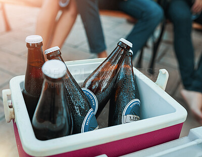 Buy stock photo Shot of bottled beers chilling in a cooler box at an outdoor gathering