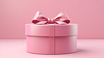 Box, gift and present with bow on pink background for surprise prize giving, celebration or party event. Bow, ribbon, wrapping paper and package for Christmas, birthday or special day giveaway.