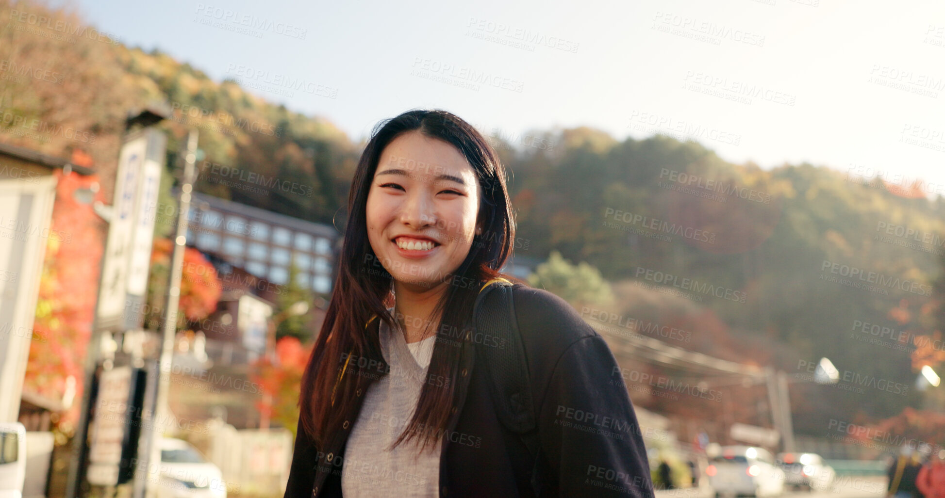 Buy stock photo Japanese woman, walking and face in city, street and sunshine with vision, idea or smile on vacation. Girl, person and metro sidewalk by buildings, hill or holiday on adventure for journey in Tokyo