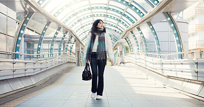 Bridge, thinking and Japanese woman in city on commute, travel and journey in metro. Walking, fashion and person with trendy clothes, casual style and bag for adventure, holiday and vacation in town