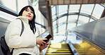 Woman, stairs and smartphone for commute, texting and japanese on social media app. Technology, communication and text message for digital, internet and chatting with backpack, travel and escaltor