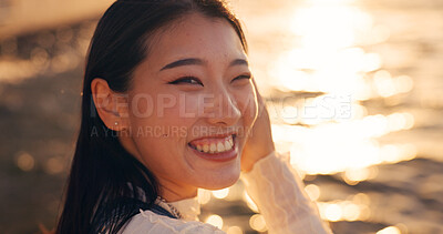 Japanese, woman and face, ocean and sunset with travel, tourism and happiness in nature. Environment, sea and traveller on adventure or journey, sunshine and portrait and tropical trip in Kyoto