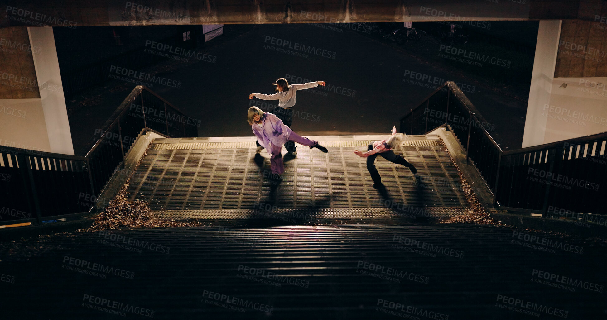 Buy stock photo Women, group and dancing on stairs in city, moving body and freedom for street performance in night. Team, dancer or people with art, concert and steps with creativity, vision and balance in Tokyo