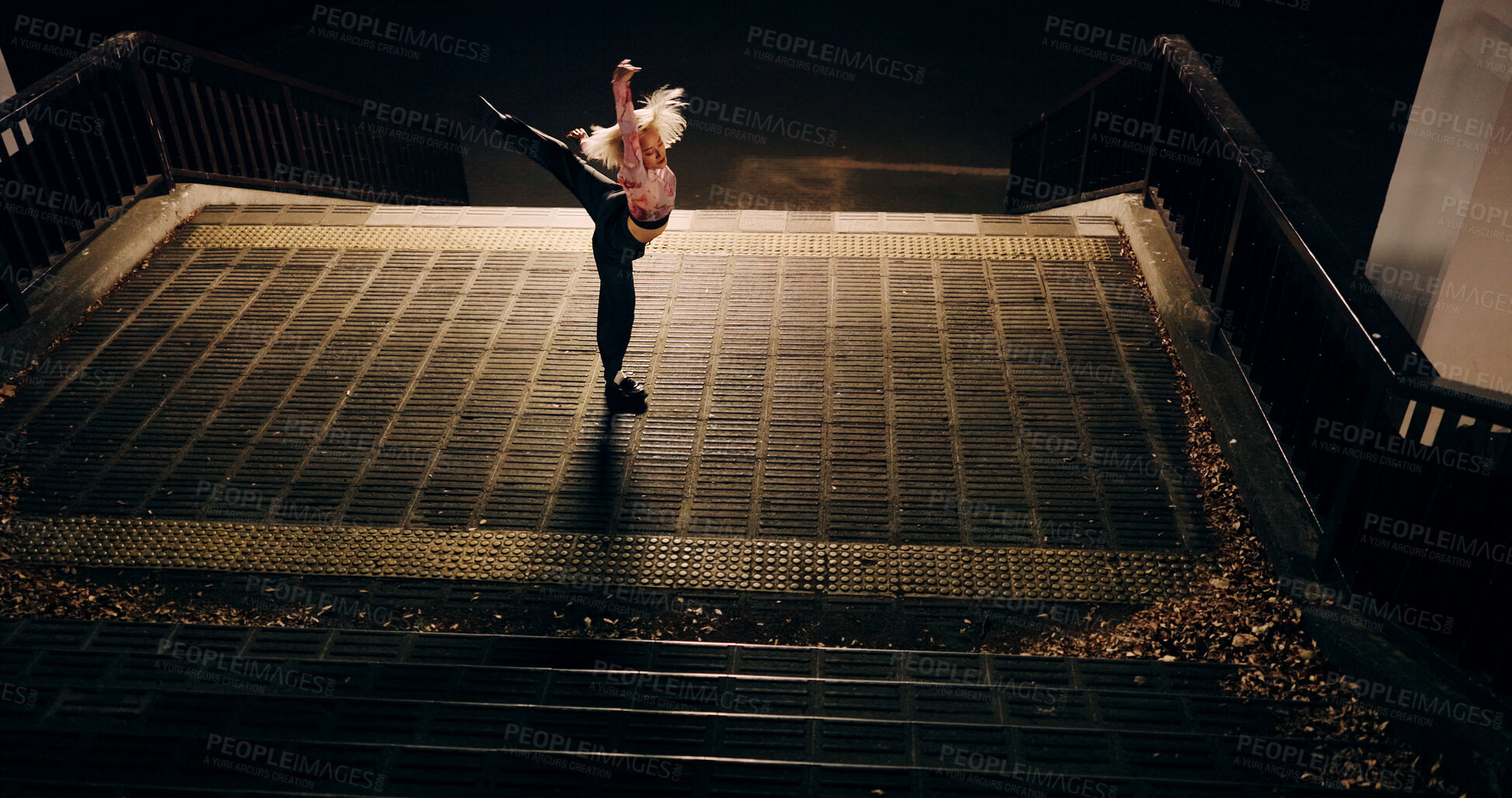 Buy stock photo Japanese woman, city and dancing on stairs, moving body and freedom for street performance in night. Girl, dancer or person with art, concert and steps with creativity, vision and balance in Tokyo