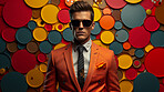 Man in suit, sunglasses, surrounded by colorful background shapes and confetti. Dapper, confident and festive individual exuding style, vibrancy and celebration in a dynamic visual display.