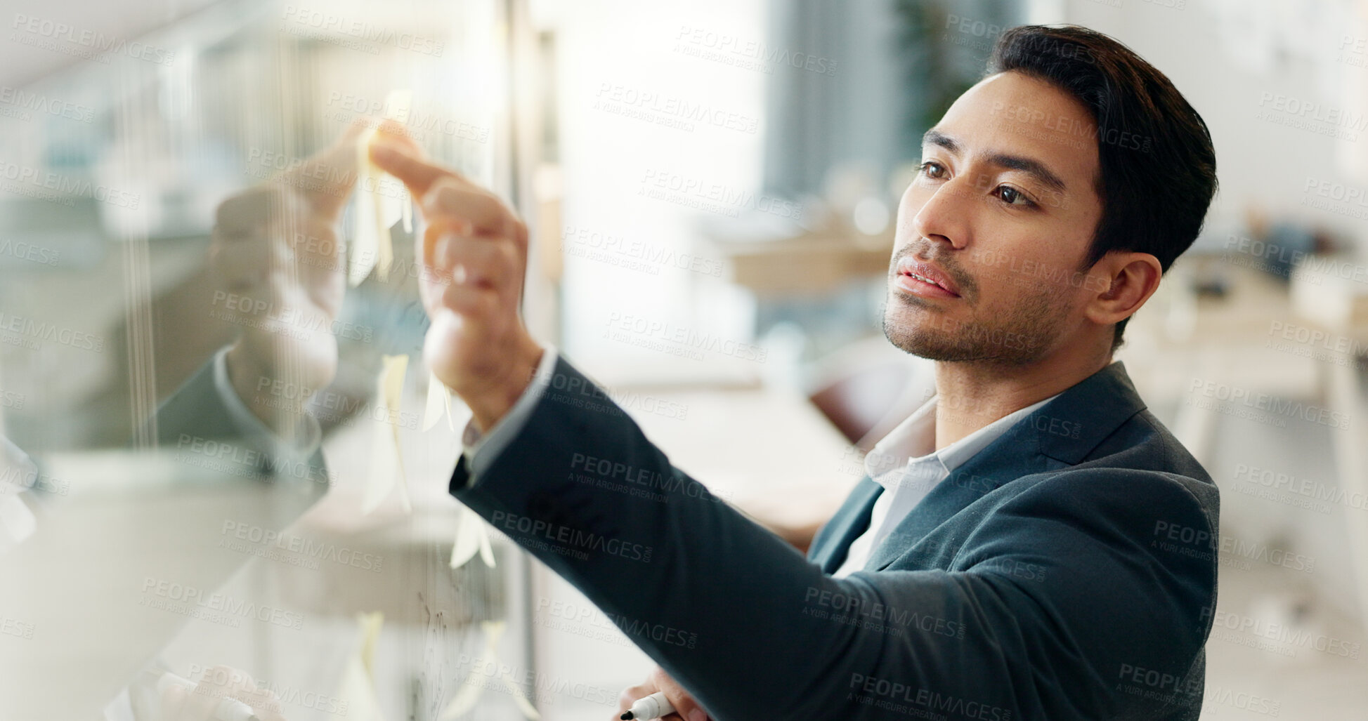 Buy stock photo Sticky note, planning and thinking, businessman on glass mindmap in office for brainstorming, agenda or schedule. Creative agency, strategy and man in design, problem solving and vision on moodboard.