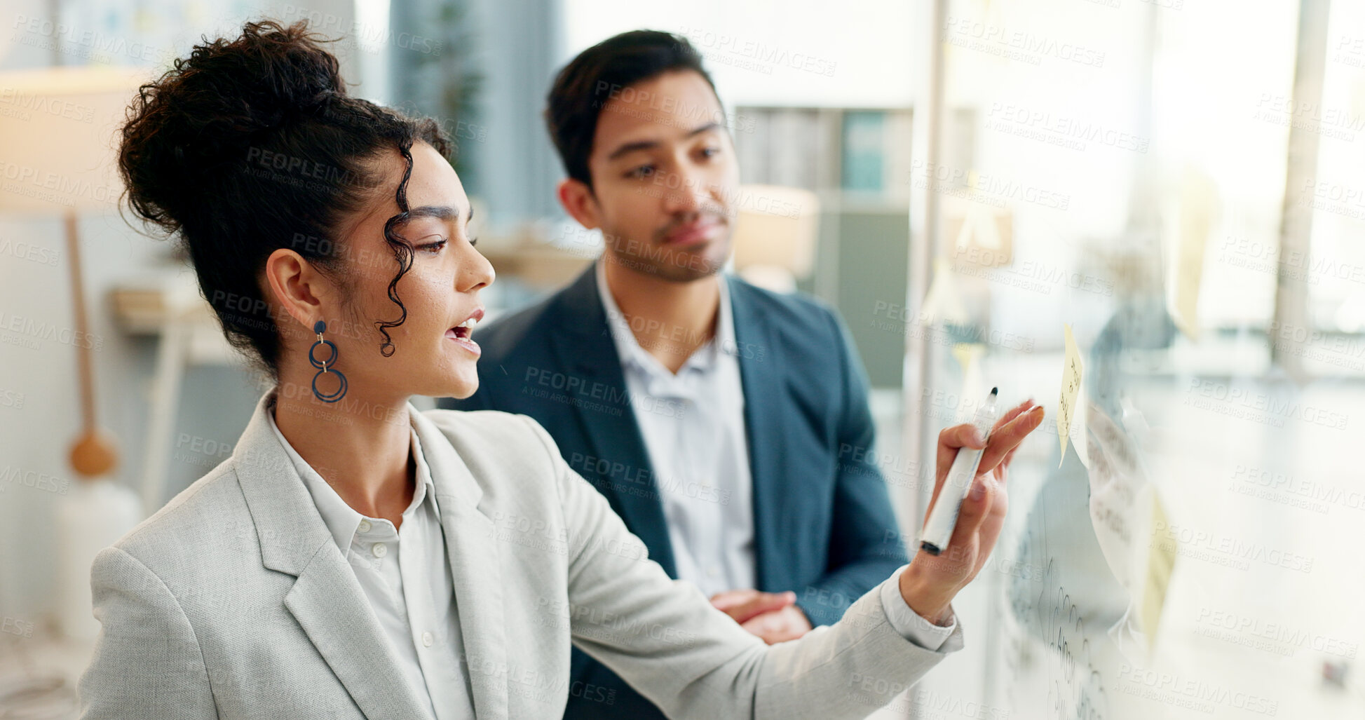 Buy stock photo Idea, discussion and business people writing on glass moodboard in office for brainstorming, agenda or schedule. Creative agency, man and woman in design team, problem solving together and mindmap.