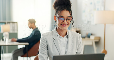 Happy woman with glasses, laptop and typing in coworking space, research and online schedule at consulting agency. Office, networking business and girl at computer writing email, review or report.